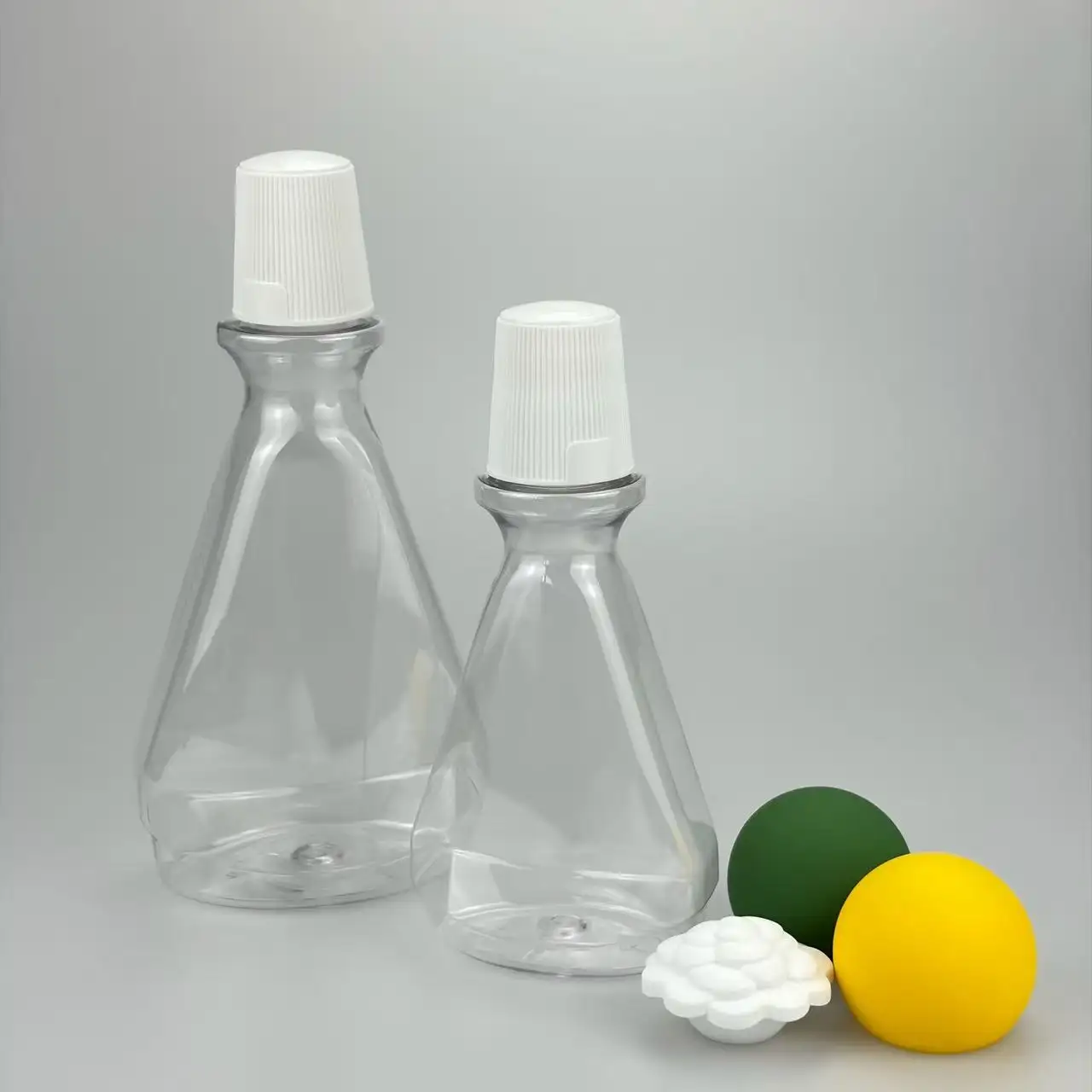 Durable 210ml non-toxic PET care bottle with ball pump. BPA-free, corrosion-resistant, perfect for oral care and skincare liquid packaging, available in multiple colors.