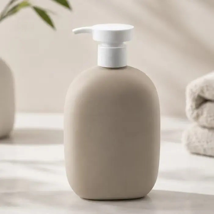 This curved oval lotion dispenser bottle features soft rounded matte khaki bottle body paired with leak-proof white press pump,