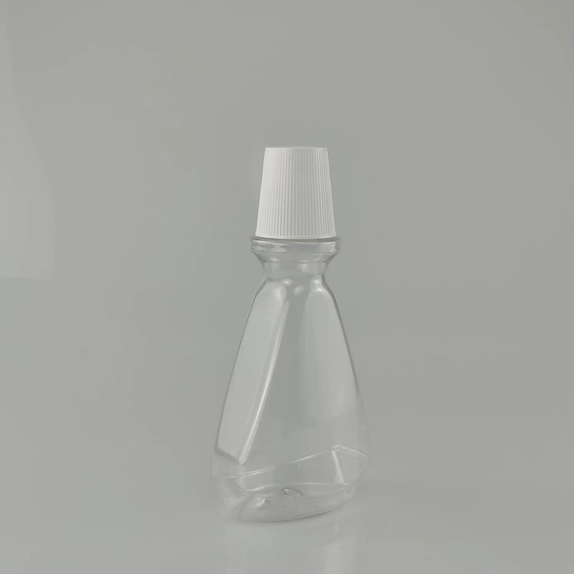 250ml Transparent Triangle Refillable PET Bottle Wholesale Screen Print Mouthwash Cream Soda Packaging